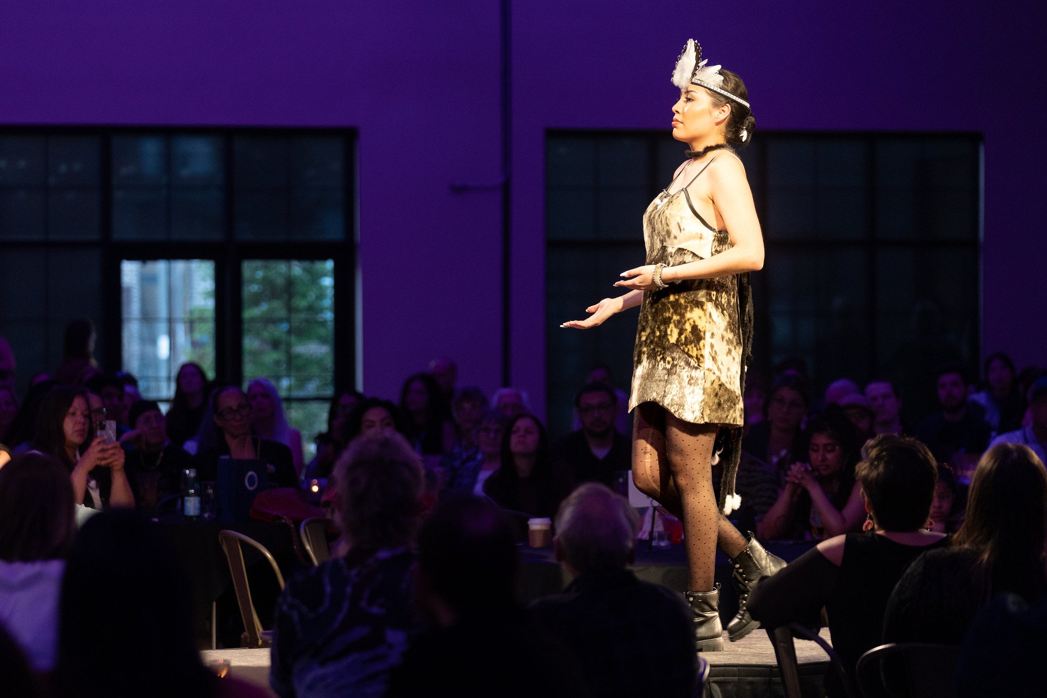 A model wearing a piece by Christy Ruby on the runway at Native Nations Fashion Night in Minneapolis