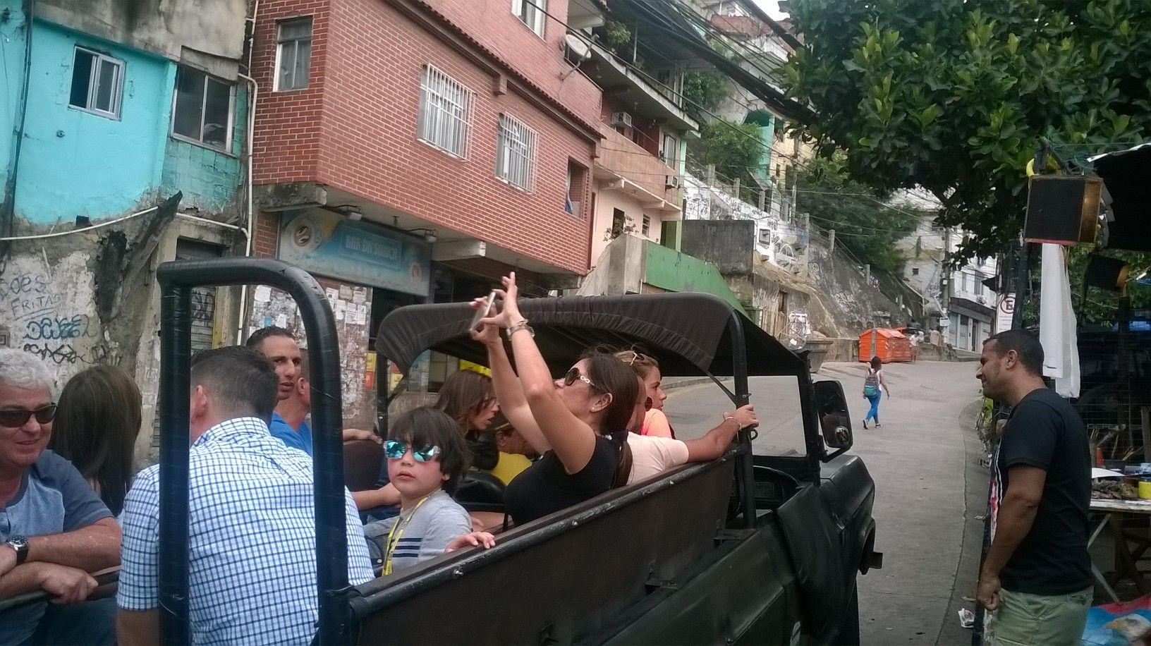 Tourists visit the Rocinha favela in a safari-like jeep, November 2015.