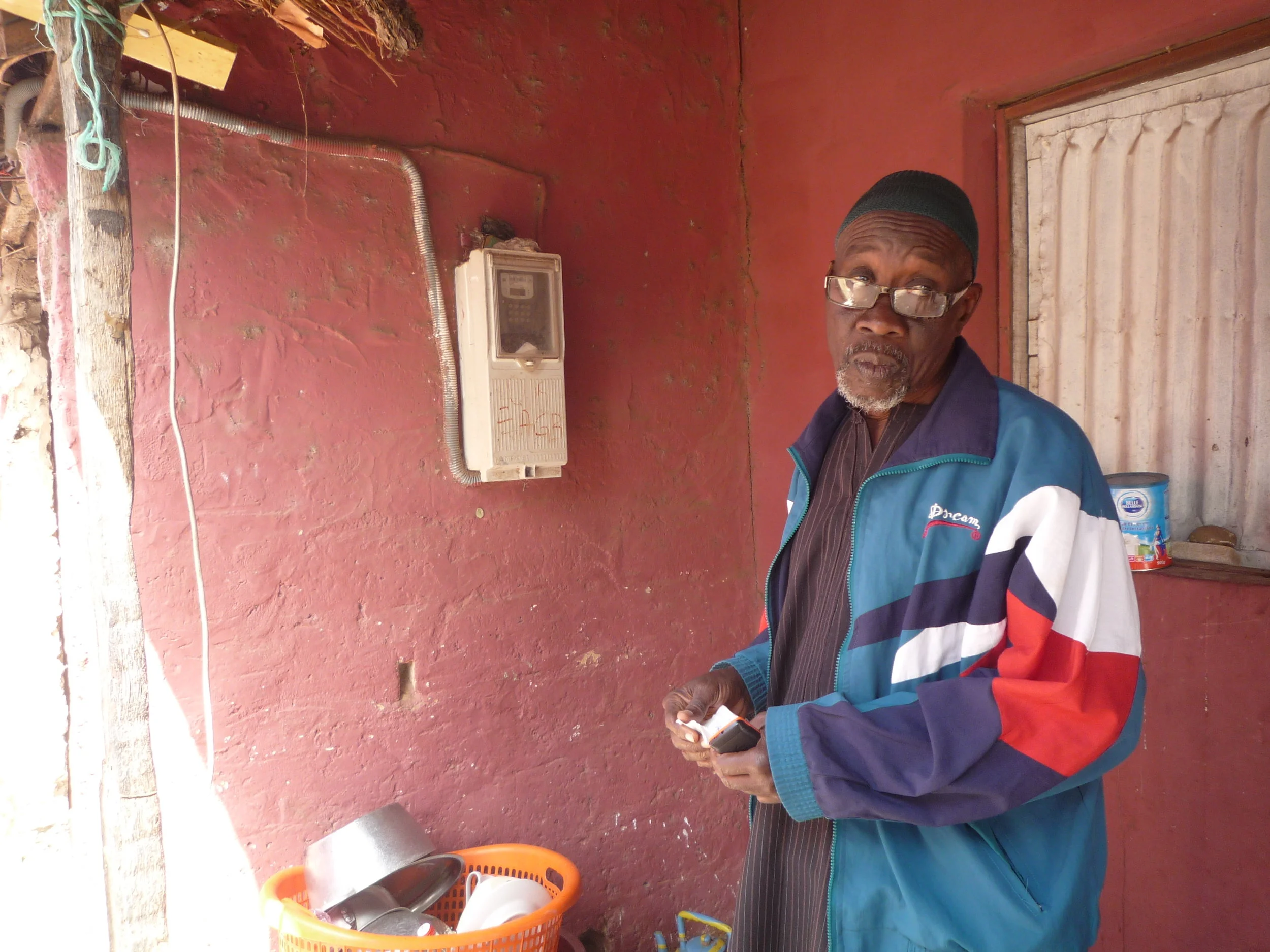 A resident explains how his pre-paid electricity meter from EAGB works.