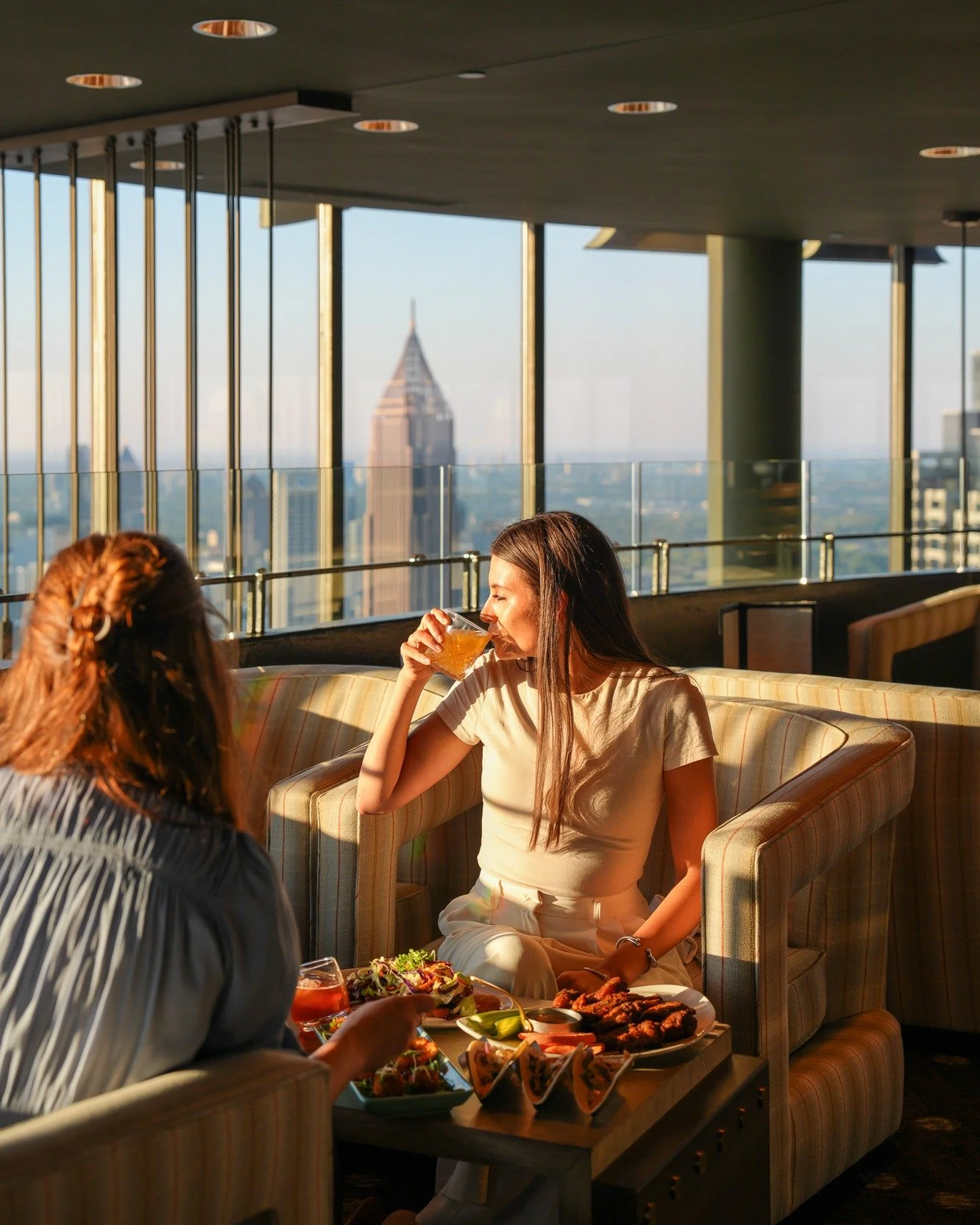 A table for your favorites. ✨

At Sun Dial, small group gatherings feel a little more elevated. Designed for parties of 10&ndash;25, the semi-private setting pairs shareable plates, crafted cocktails, and sweeping skyline views&mdash;just right for c