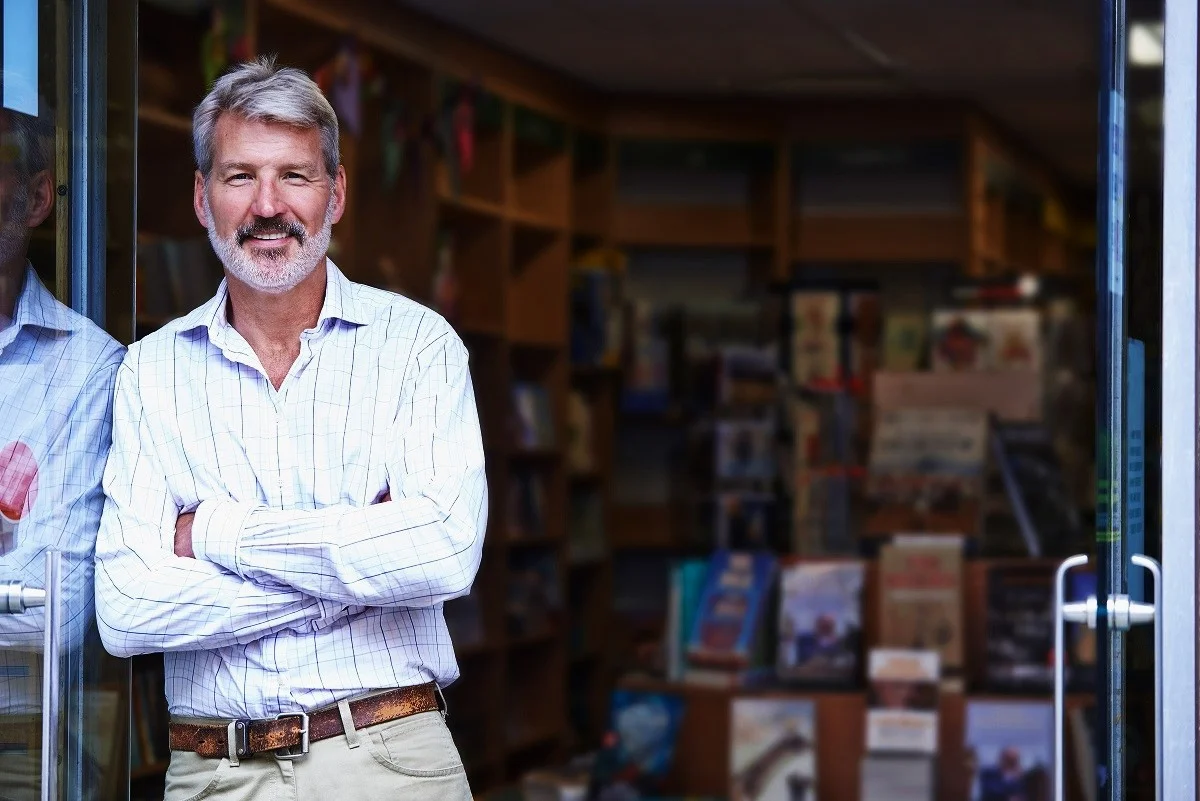 bookstore-owner-standing-outside-shop.jpg