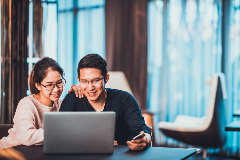couple-smiling-browsing-internet.jpg