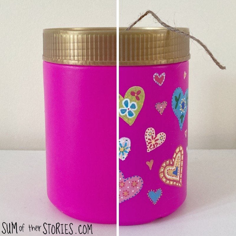 A pink plastic tub decorated with hearts and turned into a twine dispenser