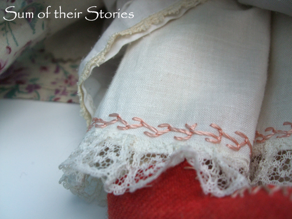 The embroidery round the hem of her underpants/bloomers