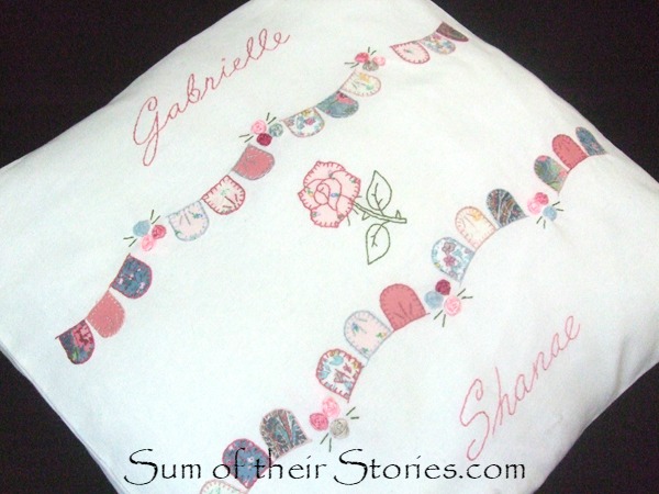 Applique and embroidered cushion