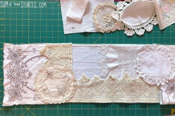 arranging vintage doilies on a long rectangle of fabric