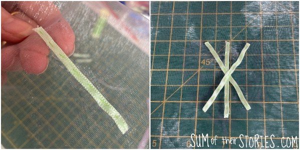 stitching green ribbon onto an organza bag