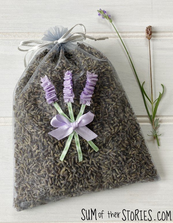 An organza bag filled with lavender and decorated with applique