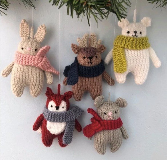 5 cute mini knitted woodland creatures wearing scarves
