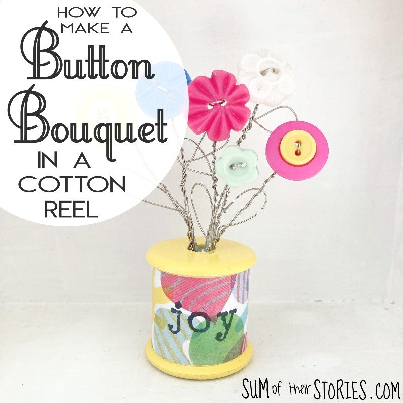 button bouquet in a cotton reel.jpeg