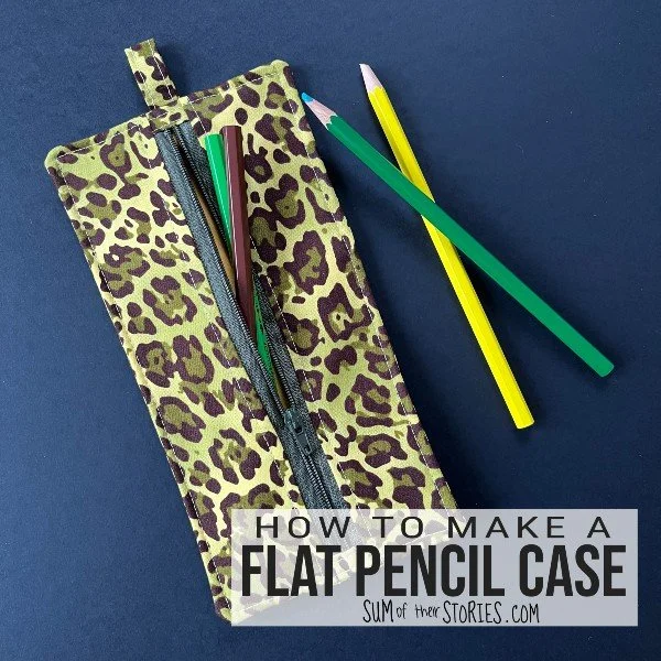 flat pencil case made from a leopard print fabric and pencils