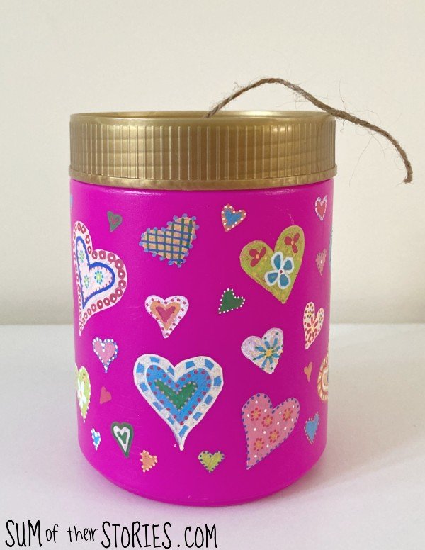 Twine dispenser upcycled from a pink plastic tub, decorated with hearts