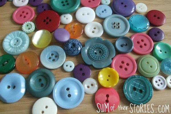 A table covered with bright coloured buttons
