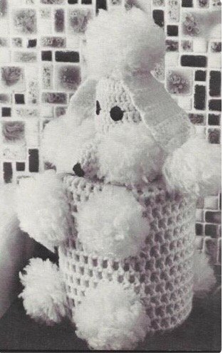 an old fashioned crocheted toilet roll cover