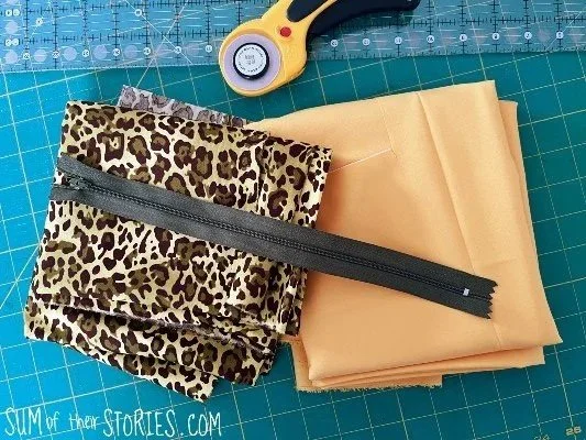cheetah print and yellow fabric with a zip ready to make a pencil case