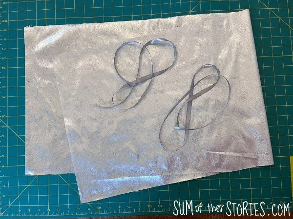 lame fabric and ribbon to make a reusable gift bag
