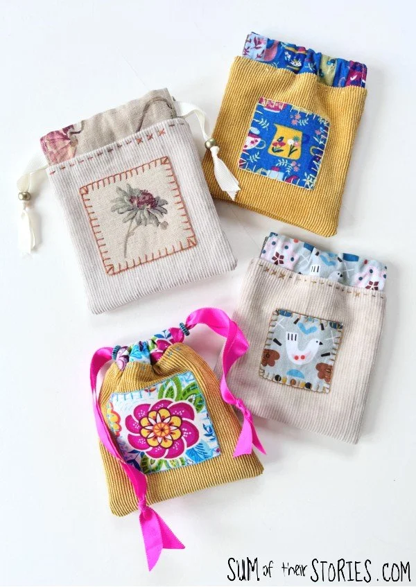 4 small fabric pouches in a mix of colours