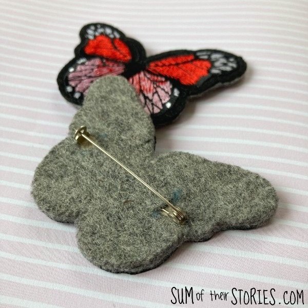 2 brooches made from butterfly embroidered patches