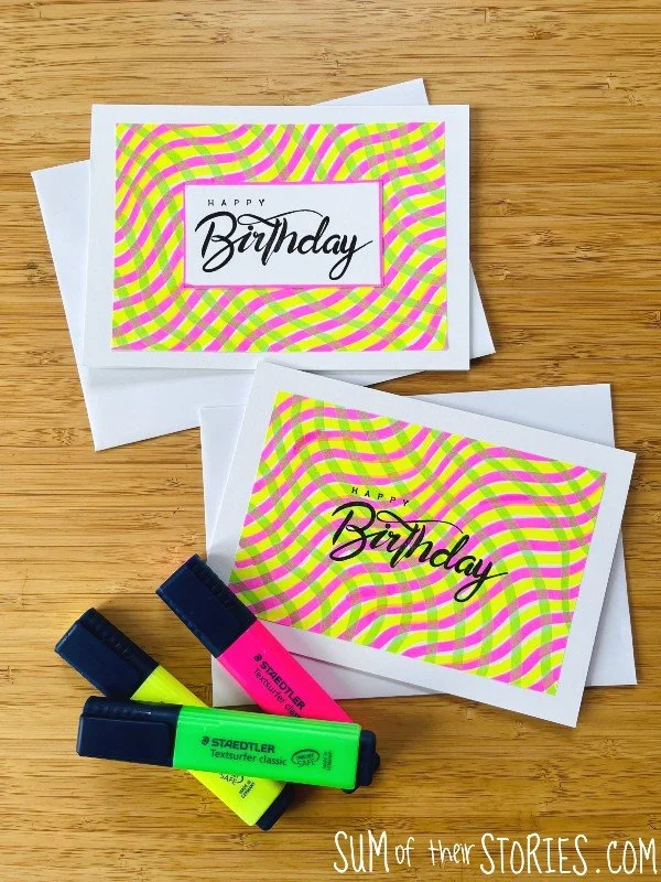 2 birthday cards with a background made with highlighters drawn in wiggly lines. There are 3 highlighter pens along side