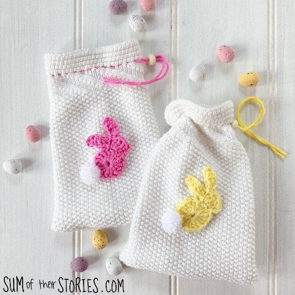 easter gift bags made from the sleeves of an old white sweater with crochet bunny embellishments