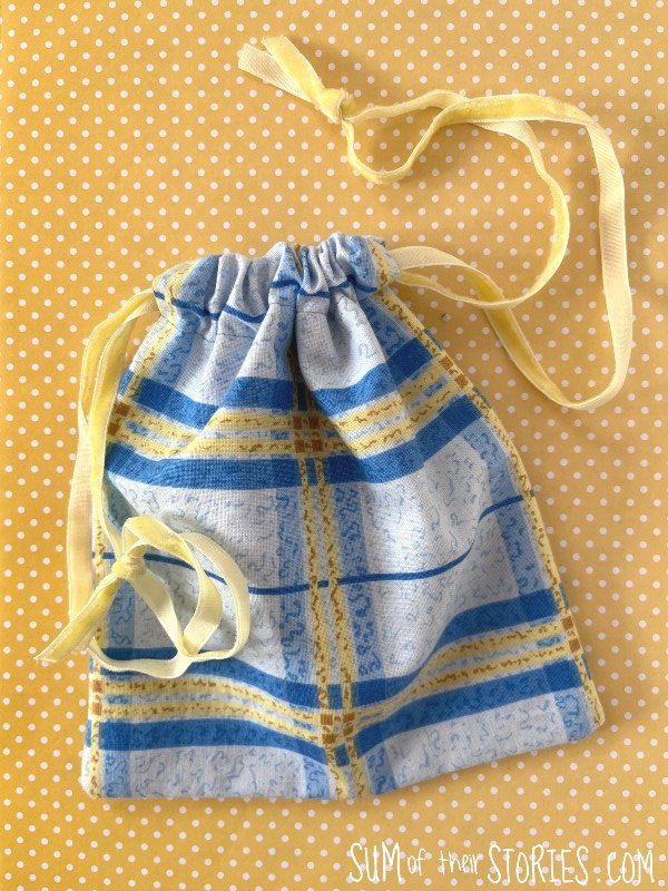 blue and yellow check drawstring bag
