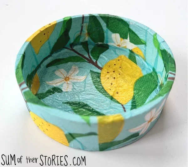trinket dish decoupaged with a blue paper napkin with lemons