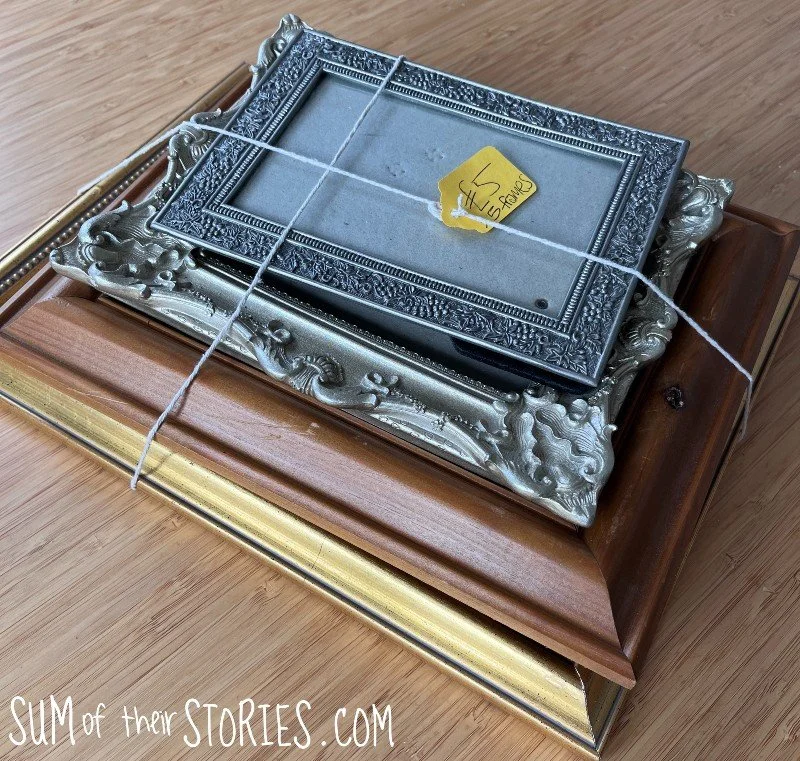 stack of 2nd hand picture frames