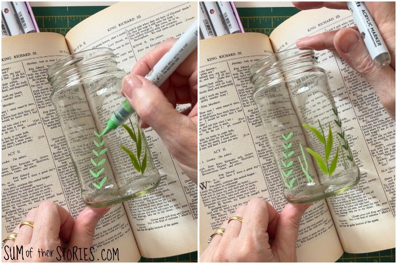 drawing green stems and leaves on an old glass jar with acrylic pens