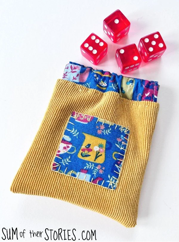 yellow and blue fabric small pouch with flex frame closure