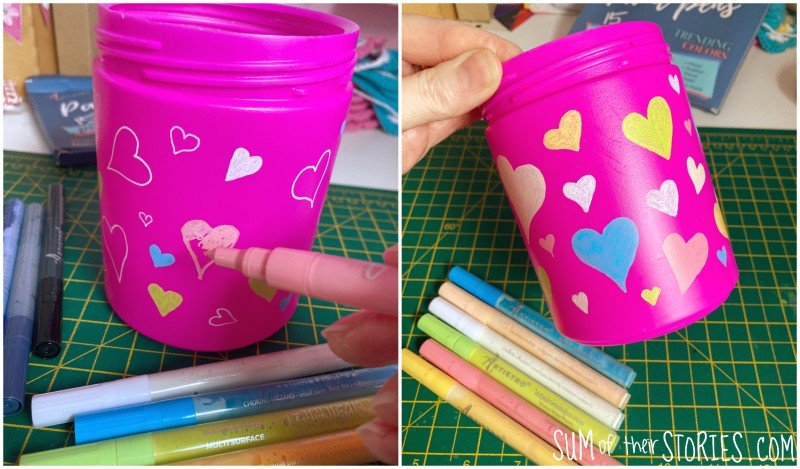 drawing hearts on a plastic tub