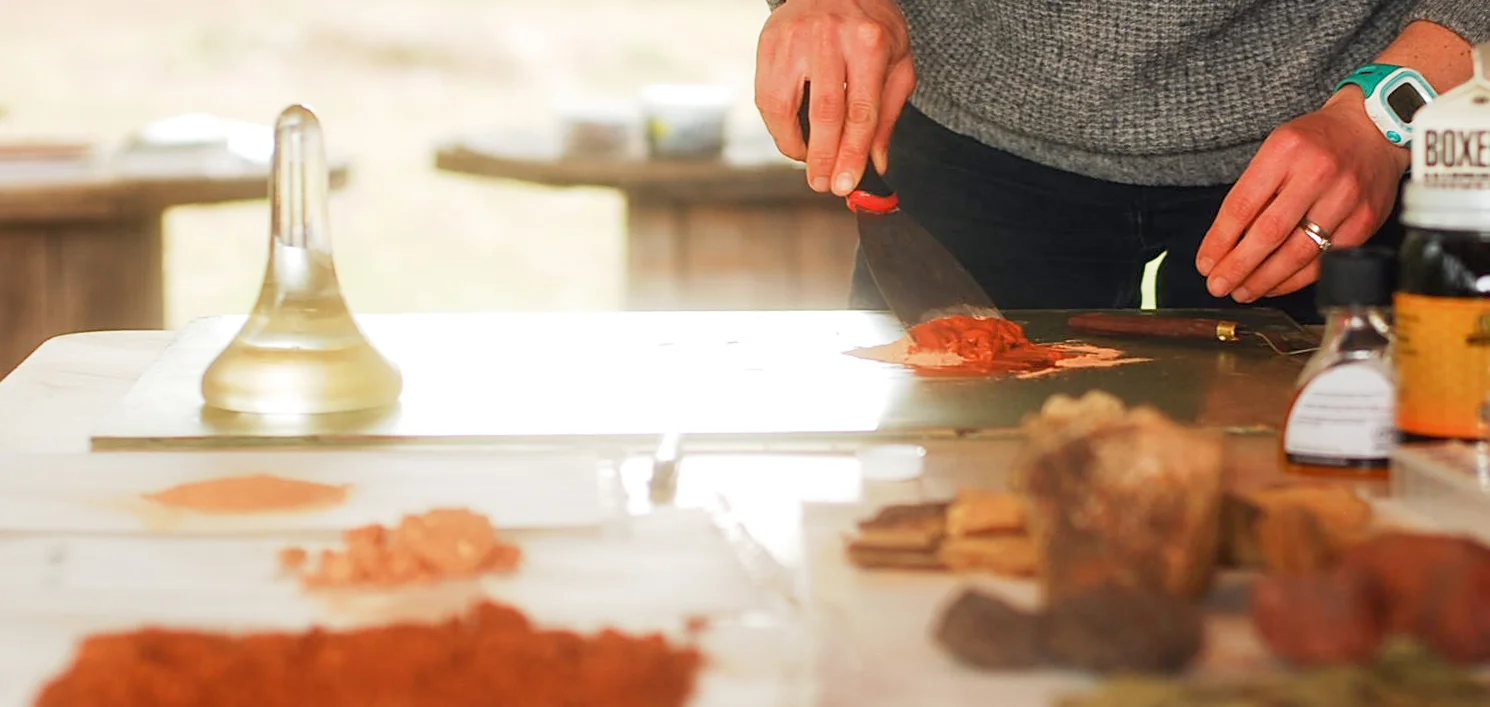 Amanda in her studio, mixing earth pigments. Photo by Kacie Lynn Hodges.