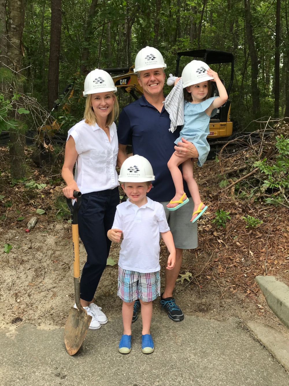 May 15, 2018: Family photo before the property is cleared (thank you Faye Bourdon for the hard hats!)