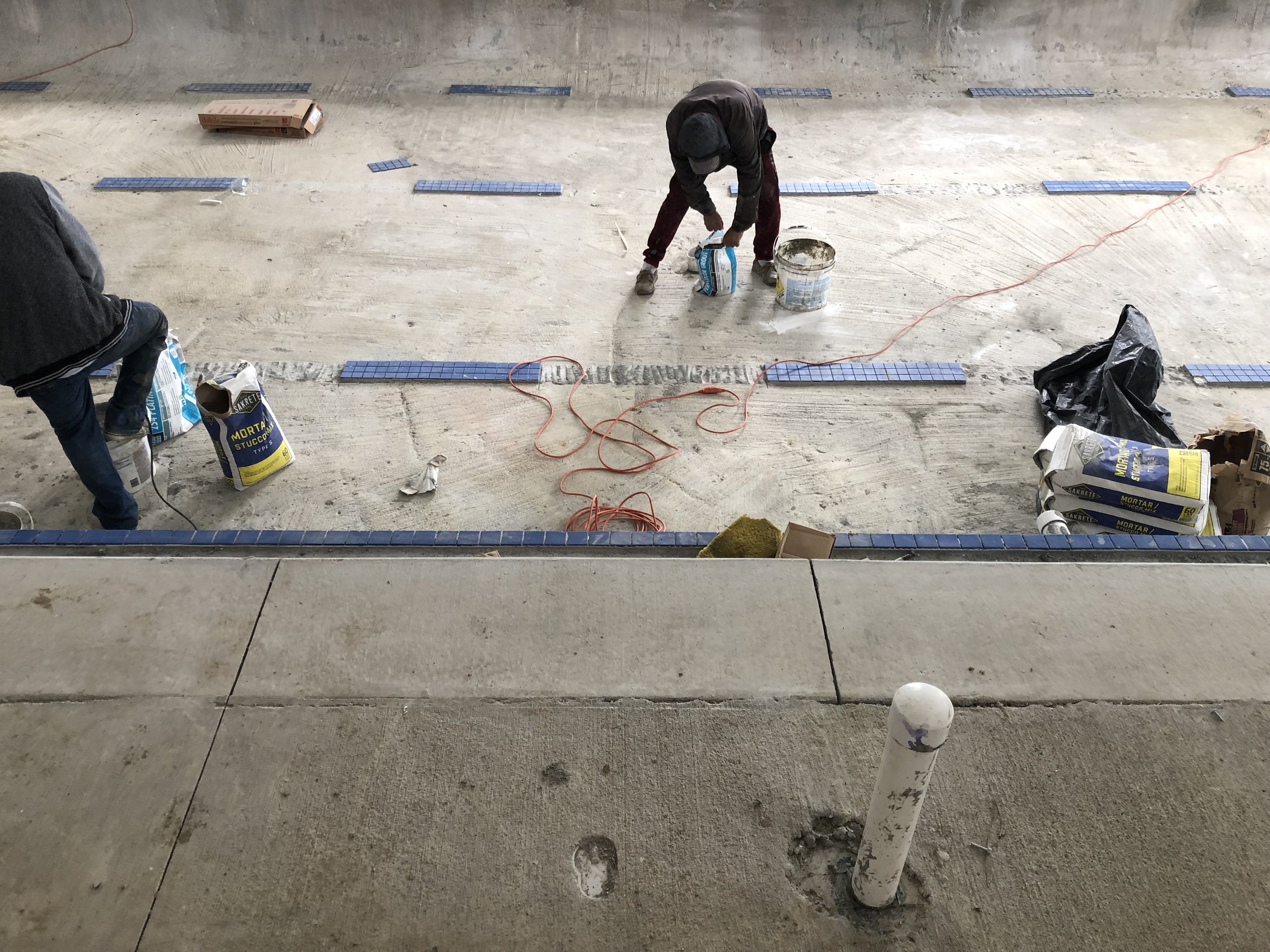 January 2019: Brighton has walls and the pool is being tiled.