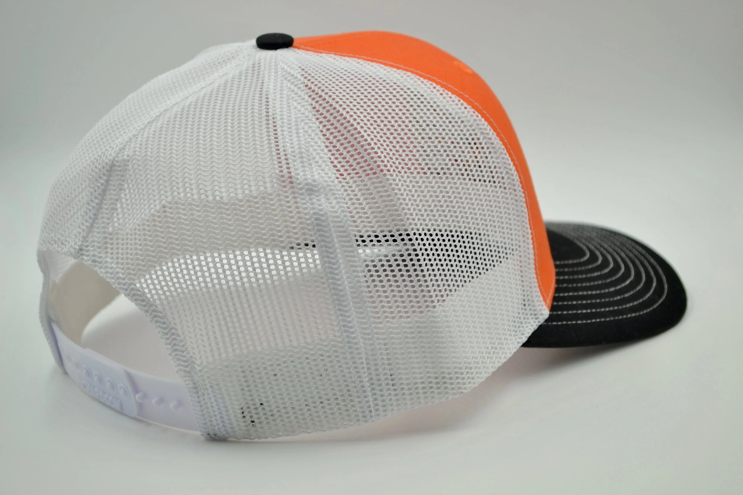 orange and white trucker hat