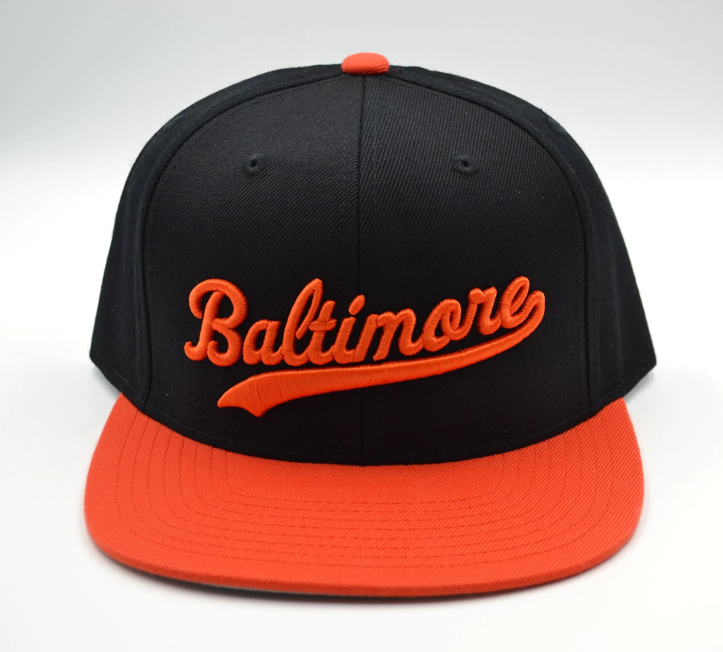 orange and black baseball hats