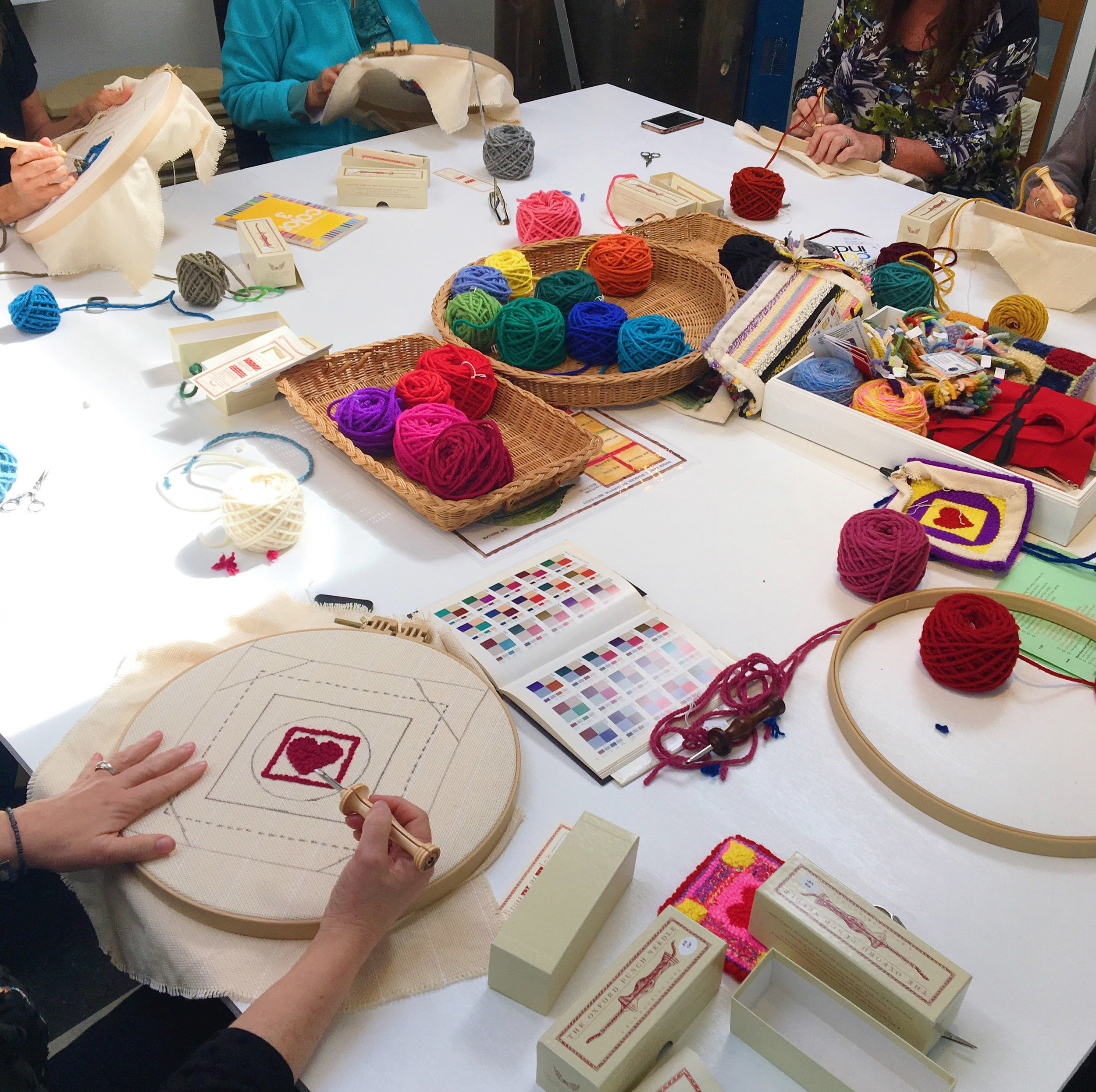 Students were able to choose colors for their projects from Hand dyed 100% wool rug yarn in bright colors for their coasters.