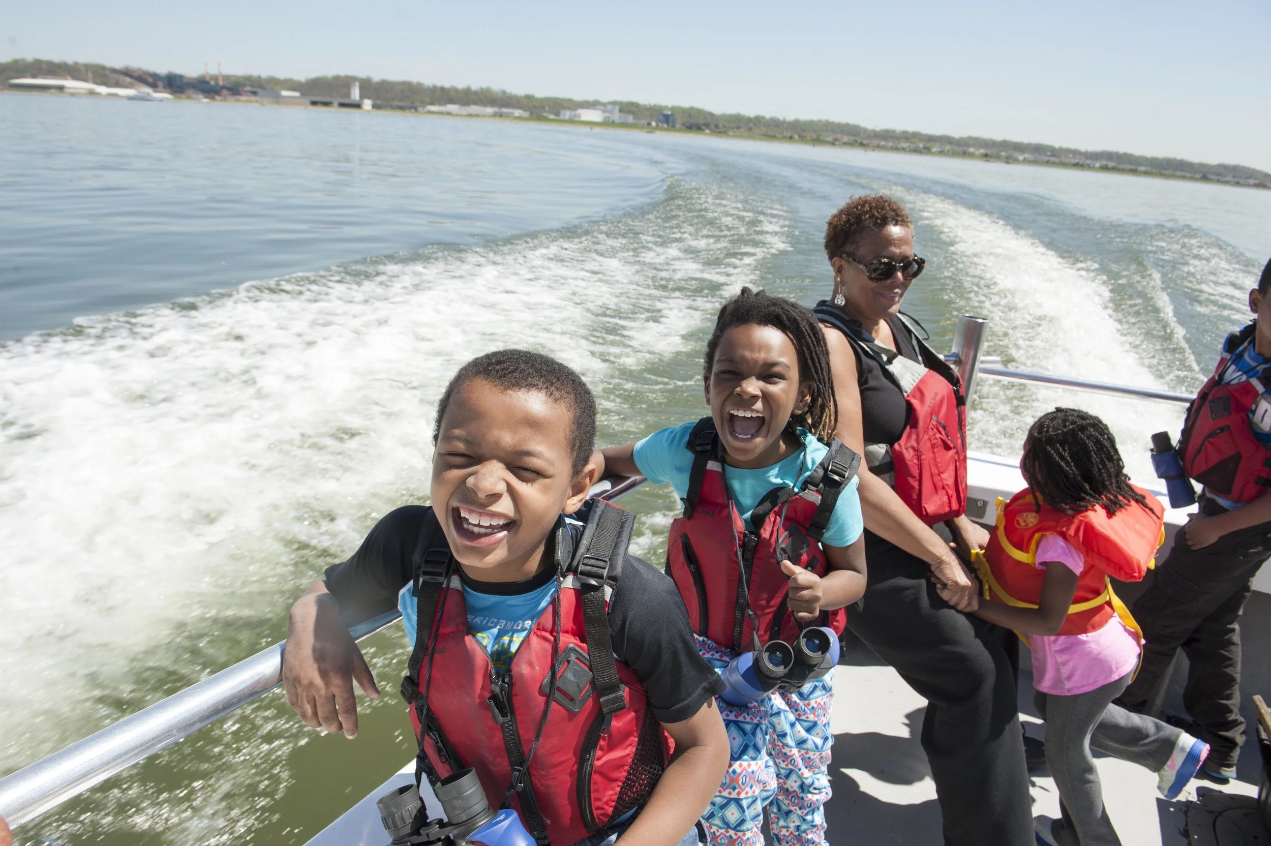 The Anacostia Community Museum Academy explores the Washington Channel and the Anacostia River aboard the Chesapeake Bay Foundation boat, The Susquehanna, 2014. Photograph by Susana Raab, Anacostia Community Museum Archives, Smithsonian Institution