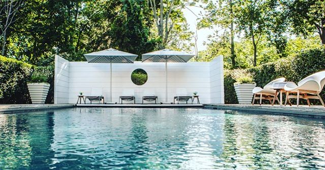 Summer days will be here before we know it, plan your pool styling today! #boywonderdesign #seasons #outdoorliving #exteriordesign #poolstyle #decor #accessories #homedesign #chaise #lounge #umbrellas #throwpillows #planters #gardenchic #poolready