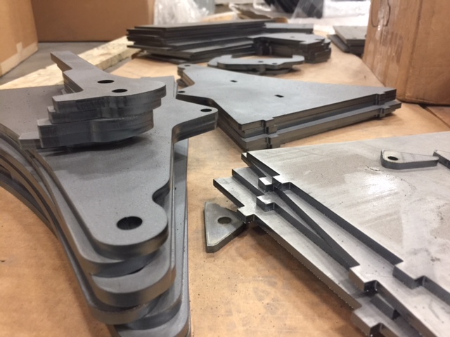 Laser cut parts waiting to be welded.