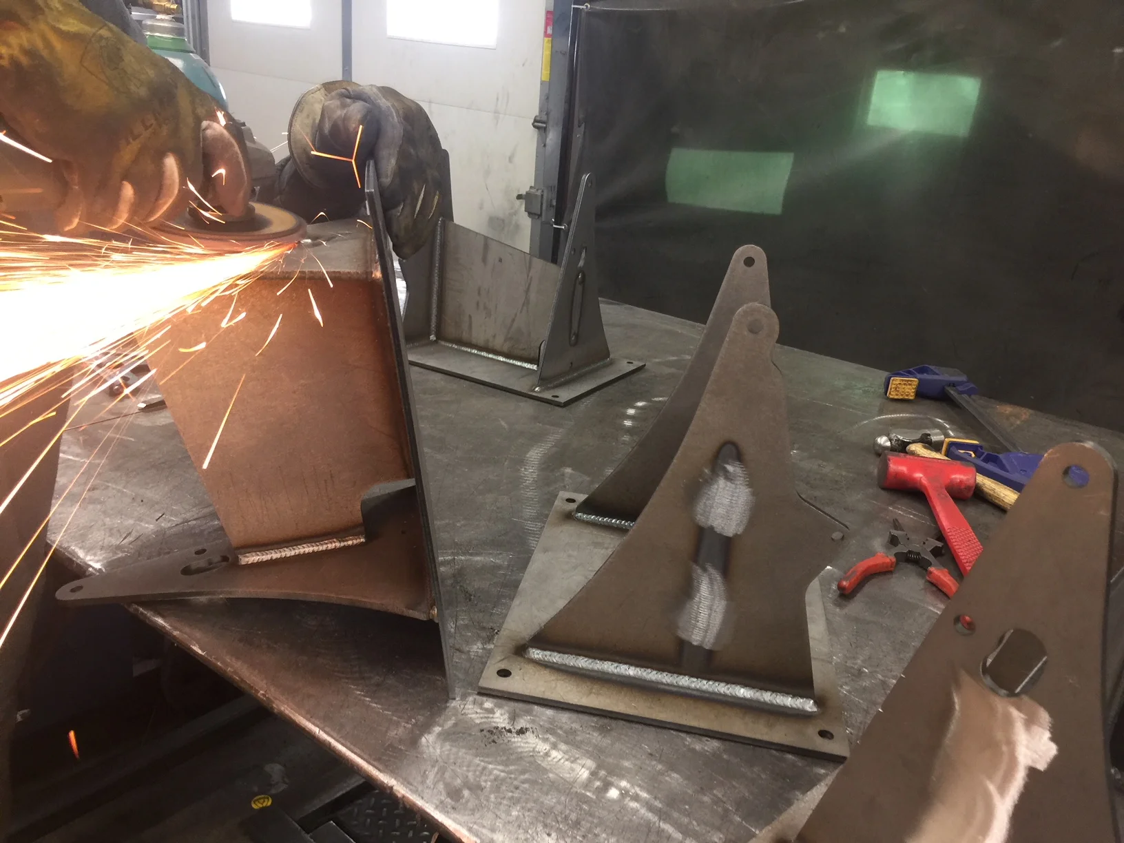 Post weld cleanup on the base weldment. These guys really know how to lay down some nice welds.