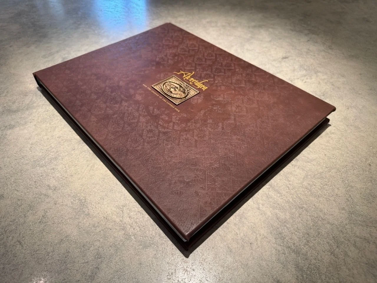 Alveridgea-Gold-Almalogue-Deluxe-Book-1.jpeg