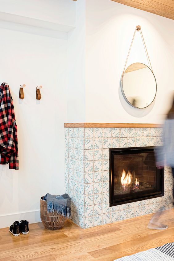 statement terra cotta tiles are fabulous for dressing up fireplaces. they can withstand the heat whilst providing a comforting vibe.