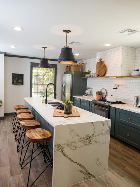waterfall countertops create a beautiful kitchen statement and contrast beautifully with bold cabinets.