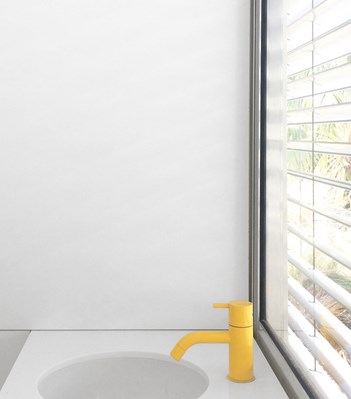 vola contemporary minimalist single hole lav faucet with top lever control and low spout in bright yellow - the ultimate guide to luxury plumbing by the delight of design