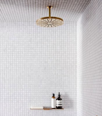 vola contemporary minimalist shower trim rainhead in unlacquered brass - the ultimate guide to luxury plumbing by the delight of design