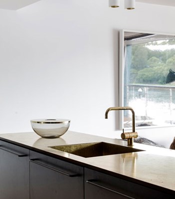 vola contemporary minimalist single hole kitchen faucet with lever handle and 90 degree spout in unlacquered brass - the ultimate guide to luxury plumbing by the delight of design