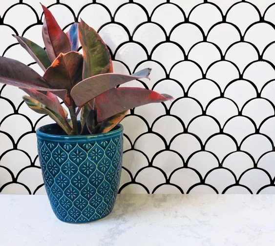 white mermaid scale scallop tiles with black statement grout