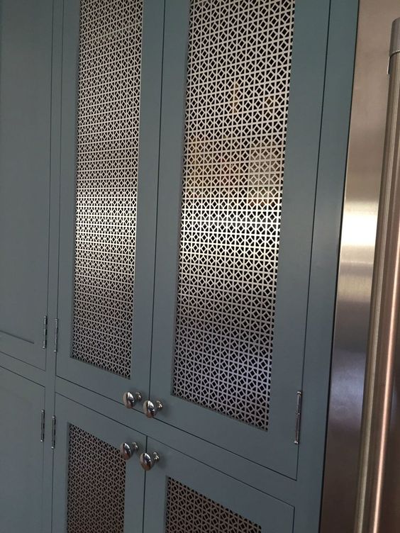 dark grey inset cabinets brass mesh metal panel insert