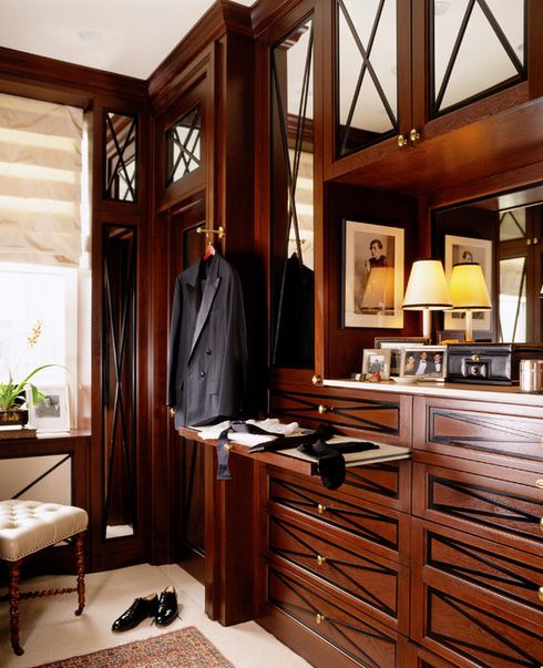 dark wood cabinet with mirror and decorative diamond mullion insert