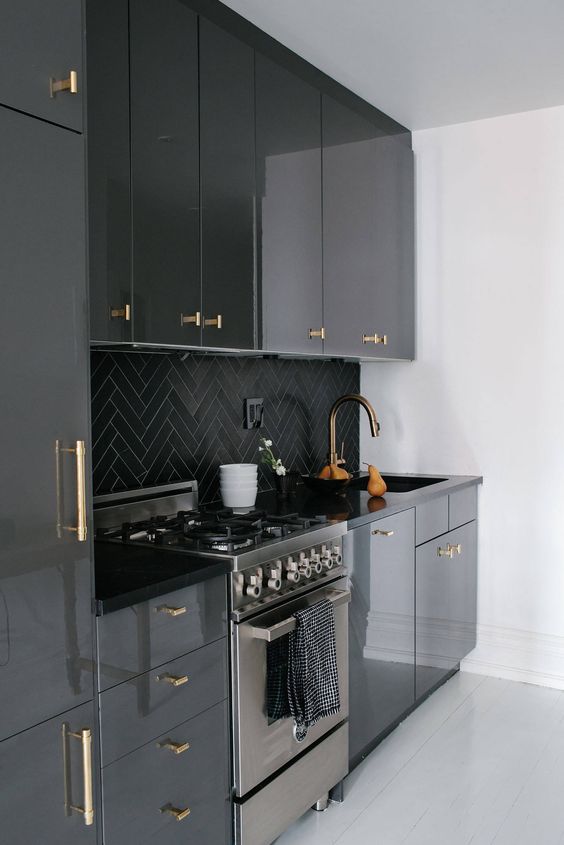 contemporary black custom ikea kitchen cabinetry gloss brass pull